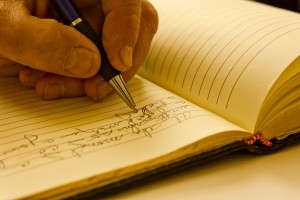 Man writing in a journal